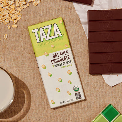 Quinoa Crunch Oat Milk bar next to unwrapped chocolate bar