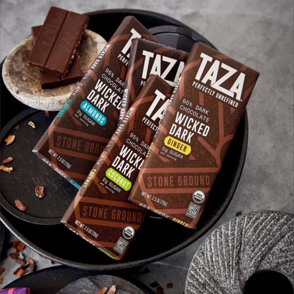 Wicked Dark Bar lying amongst similar products and unwrapped chocolate.